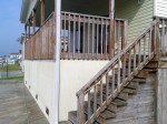 Millsboro, DE – Old stain did little to protect deck. Deck needed power washing and re-staining with solid stain