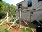 Post notched to accept beams for deck – by Deck Resurrect