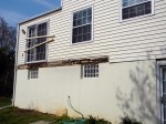 Old deck construction lacking proper flashing caused ban board to rot – Columbia, MD