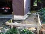 Floating walkway temporarily supported above concrete footers – by DeckResurrect