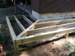 Floating walkway supported on 8" concrete footers double rims – by DeckResurrect